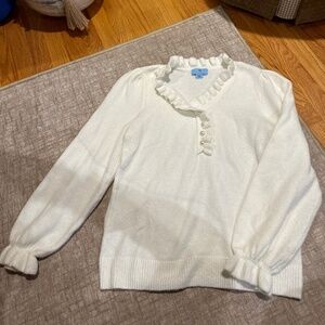 Cream ruffle sweater with pearl buttons
